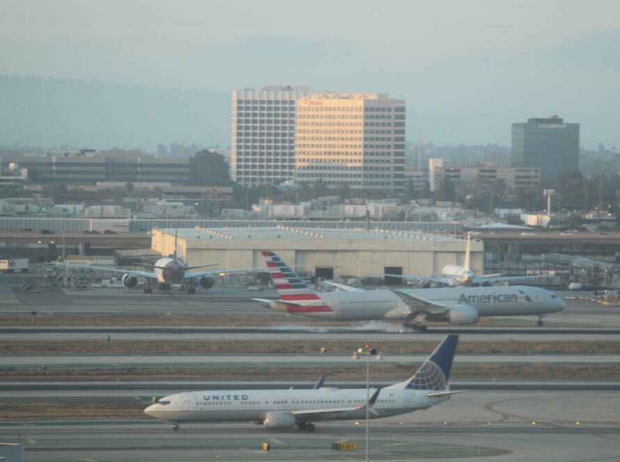 Multiple commercial aircraft taxiing at a busy airport, symbolizing strategic coordination, resource allocation, and operational clarity