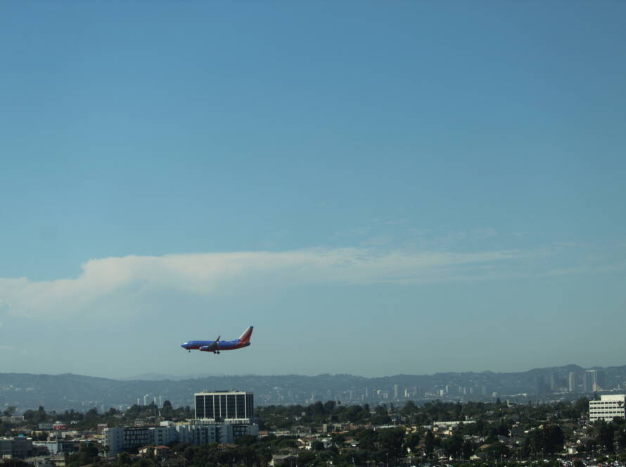 Southwest Airlines aircraft descending toward LAX with cityscape below, symbolizing strategic momentum for SME business growth