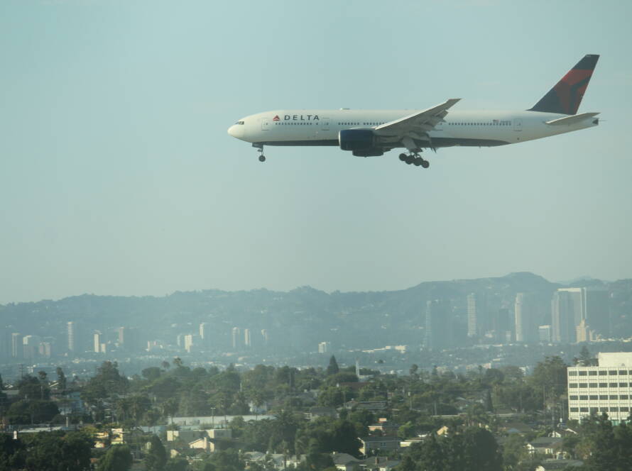 Delta aircraft descending toward LAX with landing gear down, symbolising SME leaders executing a strategic growth plan.