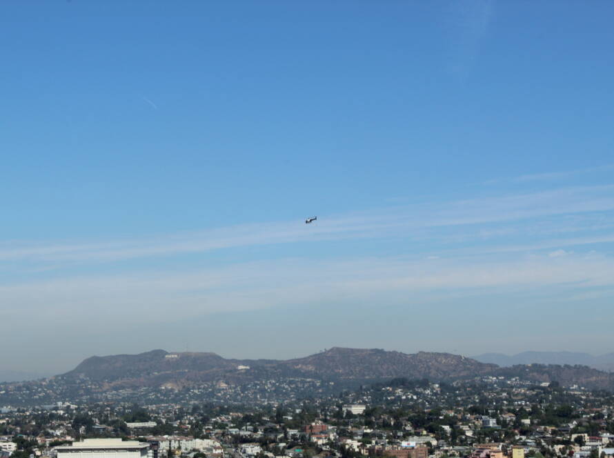 Helicopter flying over Los Angeles skyline symbolising high level SME exit strategy using the Exit Rich 6P Method.